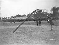 Tossing the caber. Canadian Highland Sports Meet. July, 1918. July 1918.