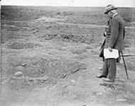 Sir Edward Kemp at the graveside of a German. Battle of Amiens. August, 1918. August 1918.