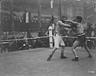 (Boxing) Pte. Finlay, 4th Div. & Gnr. Herskovitch in Corps Troops Welter Weight Boxing. "Corps Sports", Brussels, 22nd March 1919. 1914-1919