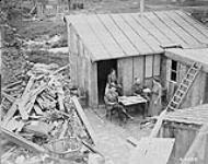 Lunch at an Estaminet amid ruins, Mericourt. April & May 1919. 1914-1919