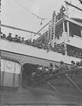 Departure of 3rd Canadian Division per S.S. "Adriatic" from Liverpool, March 1st 1919. R.C.R. greeting the 42nd as they embark  March 1, 1919.