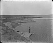 Looking up reservoir left side, toward McIllroy's [Western Irrigation Block] - (No.) 35 (C.P.R. (Canadian Pacific Railway)) 1868-1923