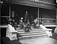 Lord Dufferin and group on the steps at Rideau Hall. before 1882