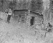 Prospector, E. Giddings, starting out with equipment from cabin, 1 mile North West of Barkerville, B.C 1938