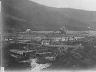 Thawing - General view of both dredges at 90 below Bonanza, Yukon Gold Co., Bonanza Creek, Yukon Territory 1925