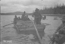 Nisutlin Bay, Scow loaded with gold seekers and moose meat on which they have lived for two months. n.d.