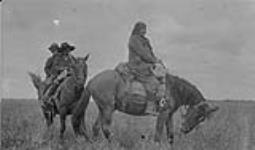 [A Dane-zaa woman and two boys on horseback near Keg River]. Original title: Indians at Kegg river prairie, Peace river Alta- Beaver squaw 1918