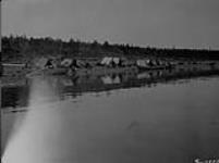 Indian skin boats at waterfront, Fort Norman, N.W.T 1921