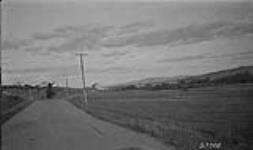 Near Sussex, N.B. showing Sussex in distance showing main highway - Kennebecasis valley 1923