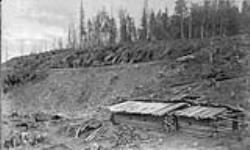 Side cutting near Tartigou house. Intercolonial Railway works/Tranchee voie secondaire pres d'une maison de Tartigou.  Travaux de l'Intercolonial. 1871-1875
