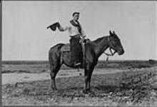 Tom Threepersons, champion bronco buster of the world. 1912
