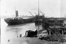Unloading Iron Ore, at Steel Company of Canada Docks, Point Edward, Ont. 1923 - 1924