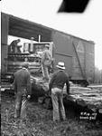 (Relief Projects - No. 14).  [Unloading a diesel caterpillar]. June 1935