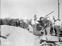 (Relief Projects - No. 21). Mixing concrete for radio beacon Station St. James. Sept. 1935