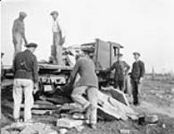 (Relief Projects - No. 33). Loading Leyland truck at the beach behing Range "A". Oct. 1933