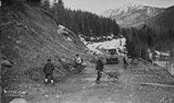 (Relief Projects - No. 102). Excavating mudslide at camp 521. Apr. 1936