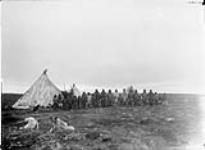 Group of Inuit outside skin tents, Chesterfield Inlet September 25, 1903.