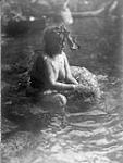 A female shaman of the Clayoquot tribe during ceremonial bathing of shamans.  [The Clayoquot is a Central Nootka tribe of British Columbia]. 1916
