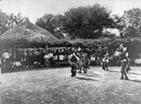 A grass-house ceremony of the Wichita.  [The Wichita reside in Caddo county, western Oklahoma]. 1930