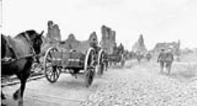 Canadian transport passing along a corduroy road built by Canadian Engineers. Advance East of Arras. August, 1918  Aug. 1918