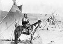 [First Nations Plains woman [Kitsipimi Otunna] on horseback, unknown location][Calgary, Alberta, 1885]  [ca. 1920-1930].