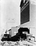 International Harvester Speed Truck pulling into elevator near Luseland, Sask. 1928