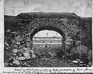 View of Arch connecting outside works of Fort Anne, Annapolis, N.S. with Magazine and showing Officers' Quarters in the distance ca. 1880
