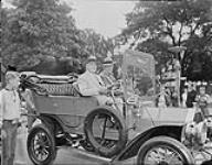 R.S. McLaughlin in old car at C.N.E., Toronto, Ont. n.d.