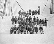 Crew of the "Neptune" in winter dress, 1903-1904. [Cmdr. A.P. Low standing front row fifth from right, Capt. Bartlett, 2nd from left]