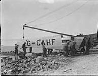 (Hudson Strait Expedition) Men handling fuselage of Fokker 'Universal' aircraft G-CAHE 'Saskatoon', Base 'B' Aug. 1927