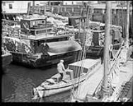 Tadoussac, P.Q., 1933, (some boats shipping lumber) 1933