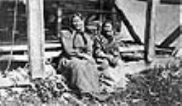 Two Ojibway women from Flying Post First Nation during Treaty 9 payment ceremony at New Brunswick House, Ontario, July 1906 July 1906.