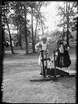 Edna [Boyd] and Clair at pump, Lake Huron Park, [Ont.]. 1907. 1907.