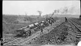 Dumping train of dirt near Lock 4 (during construction of the) new Welland Canal. 17 Apr. 1914