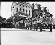 Trumpeters blowing fanfare to herald the arrival of H.M. King George VI and Queen Elizabeth for the unveiling of the National War Memorial  21 May 1939