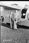 Hon. Ian Mackenzie (right) and Col. Clyde Scott with Grumman 'Goose' II aircraft 917(?) of the R.C.A.F. 18 Aug 1939