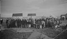 "View of the dance, it's after dawn but they're still going strong". Dogrib First Nation Treaty Dance. 1937