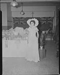 Mrs. Quinn [beside display of] Avon Products, [Quebec, P.Q.], 29 May, 1949 29 May 1949
