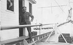 R.C.C.S. wireless operator aboard S.S. "Distributor", during Voyage of H.E. Baron Byng of Vimy down the Mackenzie River, N.W.T. 1925. 1925