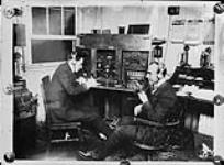 Messrs. Cann and Argyle operating Marconi Fonel half-kilowatt wireless set, n.p., n.d.