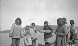 [Group of Inuit at Hebron] Original title: Natives at Hebron. September 1926.