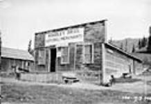 Woodley Bros. General Merchants' Store [and Post Office] at Entrance, [Alta.]. 1919