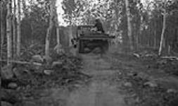 Y2 - Power Development truck on short portage between Yellowknife River and Prosperous Lake. July 1940