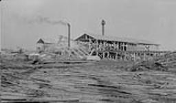 Yellowknife Lumber Co. Saw Mill showing piles of slabs and edgings. 1940