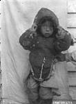 Inuit child dressed in Eider Duck skins. S.W. Blechers. 1927