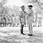 [Lieutenant-General Sir Bernard Montgomery investing Corporal H.E. Brant of the Hastings and Prince Edward Regiment with the Military Medal. Catanzaro, Italy.]. [13 Sept. 1943]