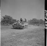 Troop carrier of the Toronto Scottish in action. 8 Aug. 1944