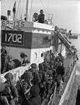 Infantrymen of The North Nova Scotia Highlanders boarding LCI(L) 135 of the 2nd Canadian (262nd RN) Flotilla  during a pre-invasion training exercise, England, 9 May 1944. May 9, 1944.