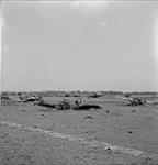 Burnt out aircraft. 6 Aug. 1943