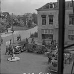 Vehicles outside building which was site of international conference on food distribution in the Netherlands. 2 May 1945